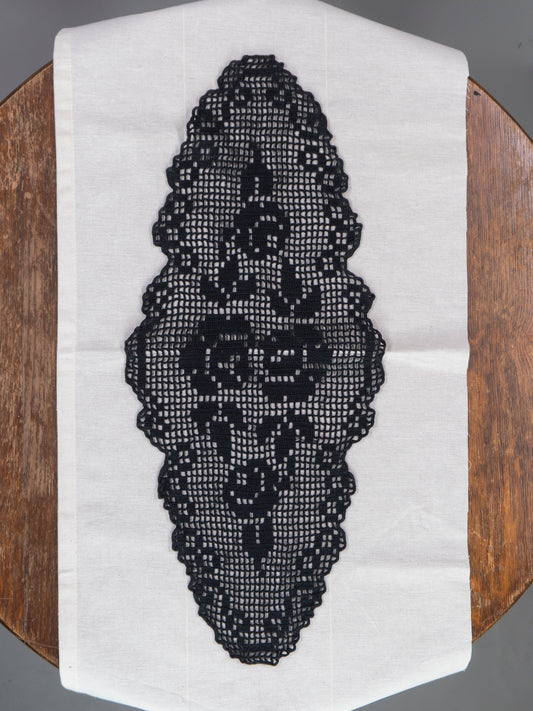 Black crocheted lace doily